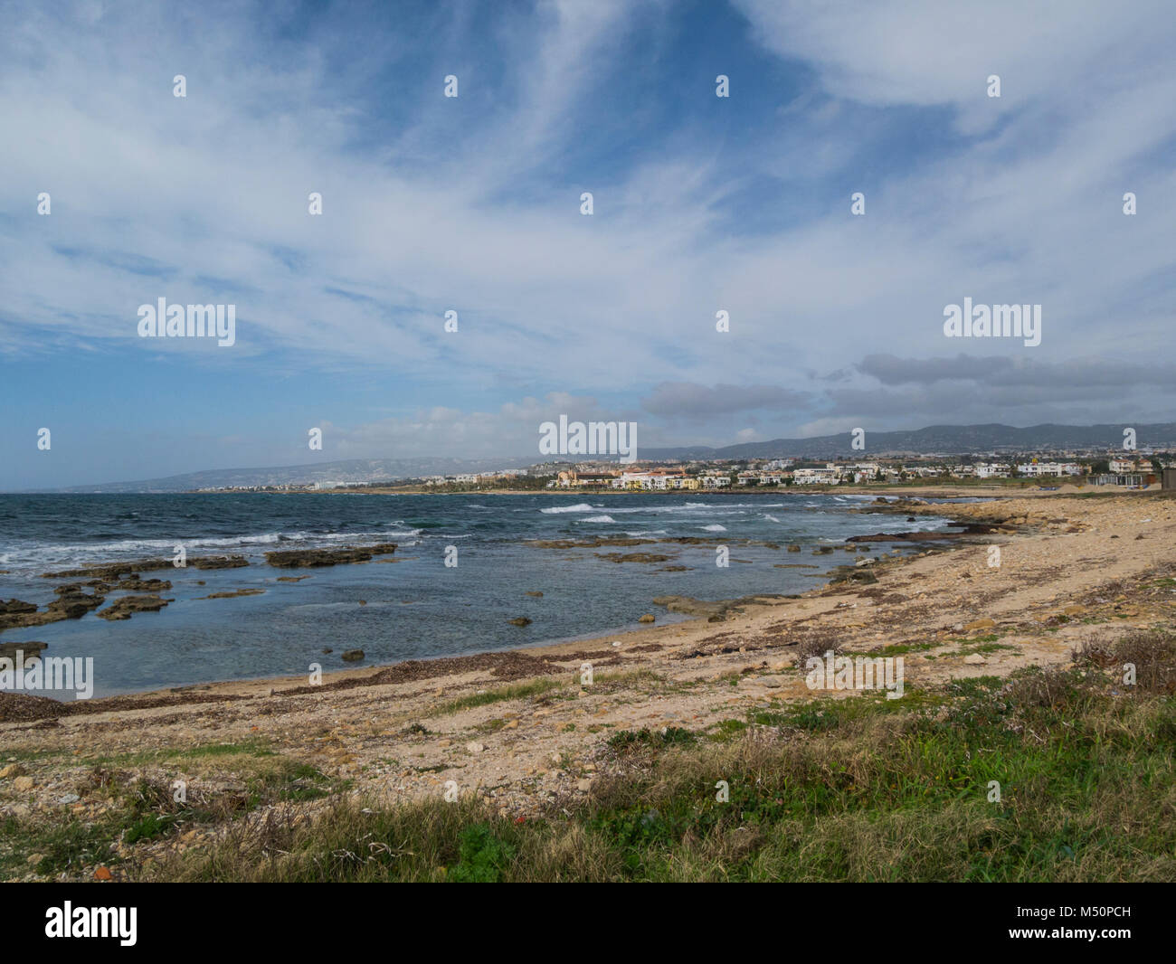 View from Paphos coastal path towards Kefalos Beach and Pano Pafos Old Market Area Upper Town Cyprus on a lovely February winters day weather Stock Photo