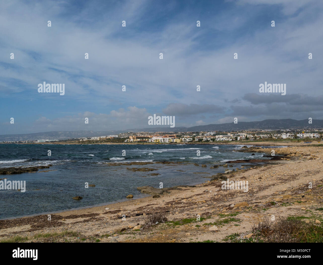 View from Paphos coastal path towards Kefalos Beach and Pano Pafos Old Market Area Upper Pafos Cyprus on a lovely February winters day weather Stock Photo