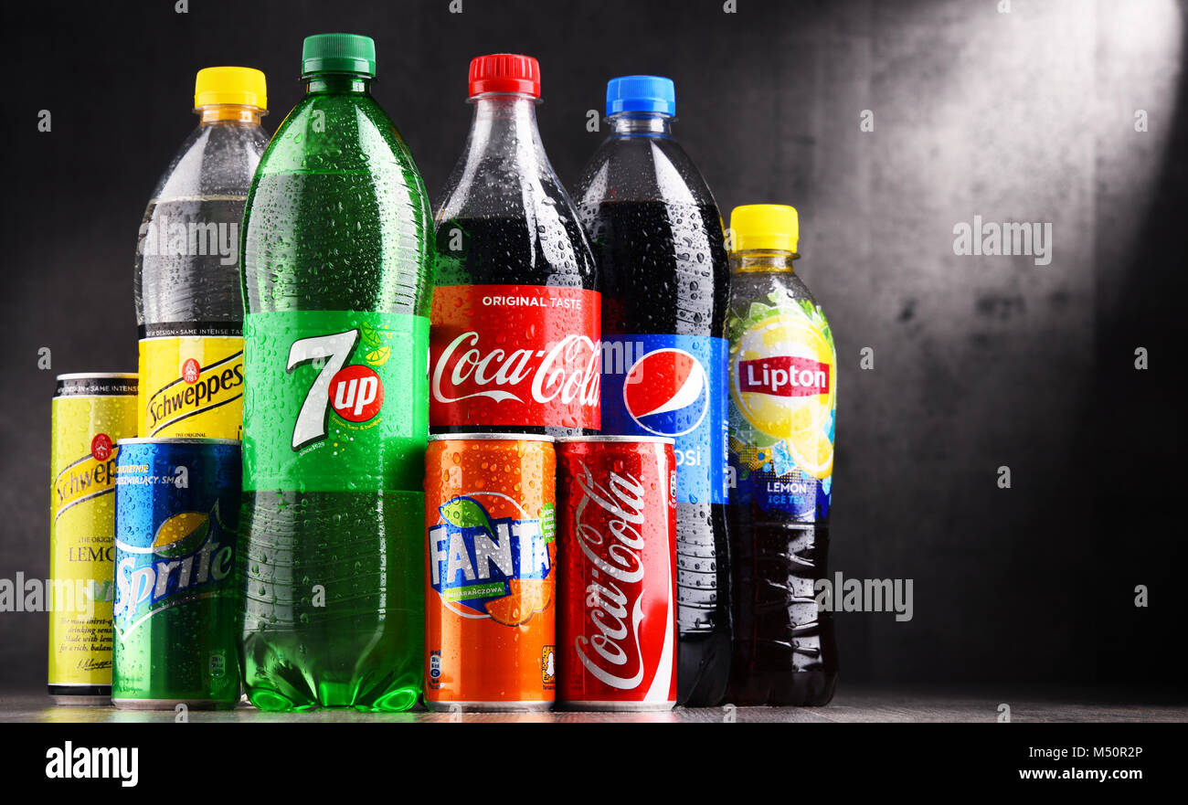 Bottles and cans of assorted global soft drinks Stock Photo Alamy