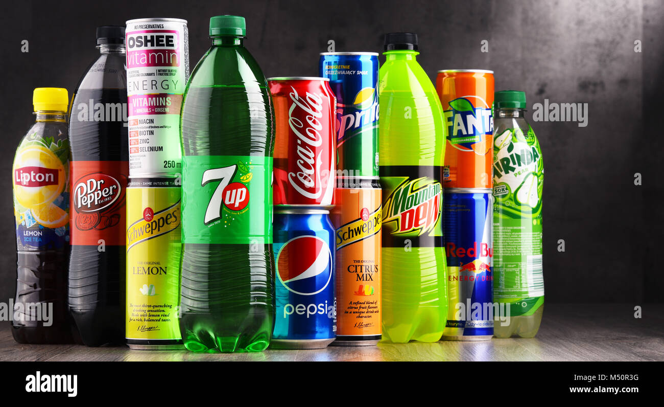 Bottles and cans of assorted global soft drinks Stock Photo Alamy