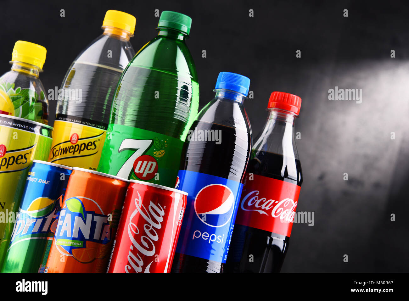 Bottles and cans of assorted global soft drinks Stock Photo Alamy