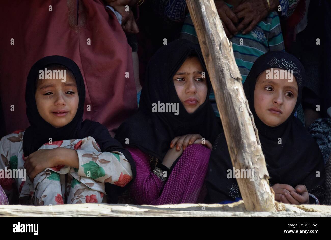 Srinagar, Kashmir. 19th Feb, 2018. Kashmiri girls crying while watching ...