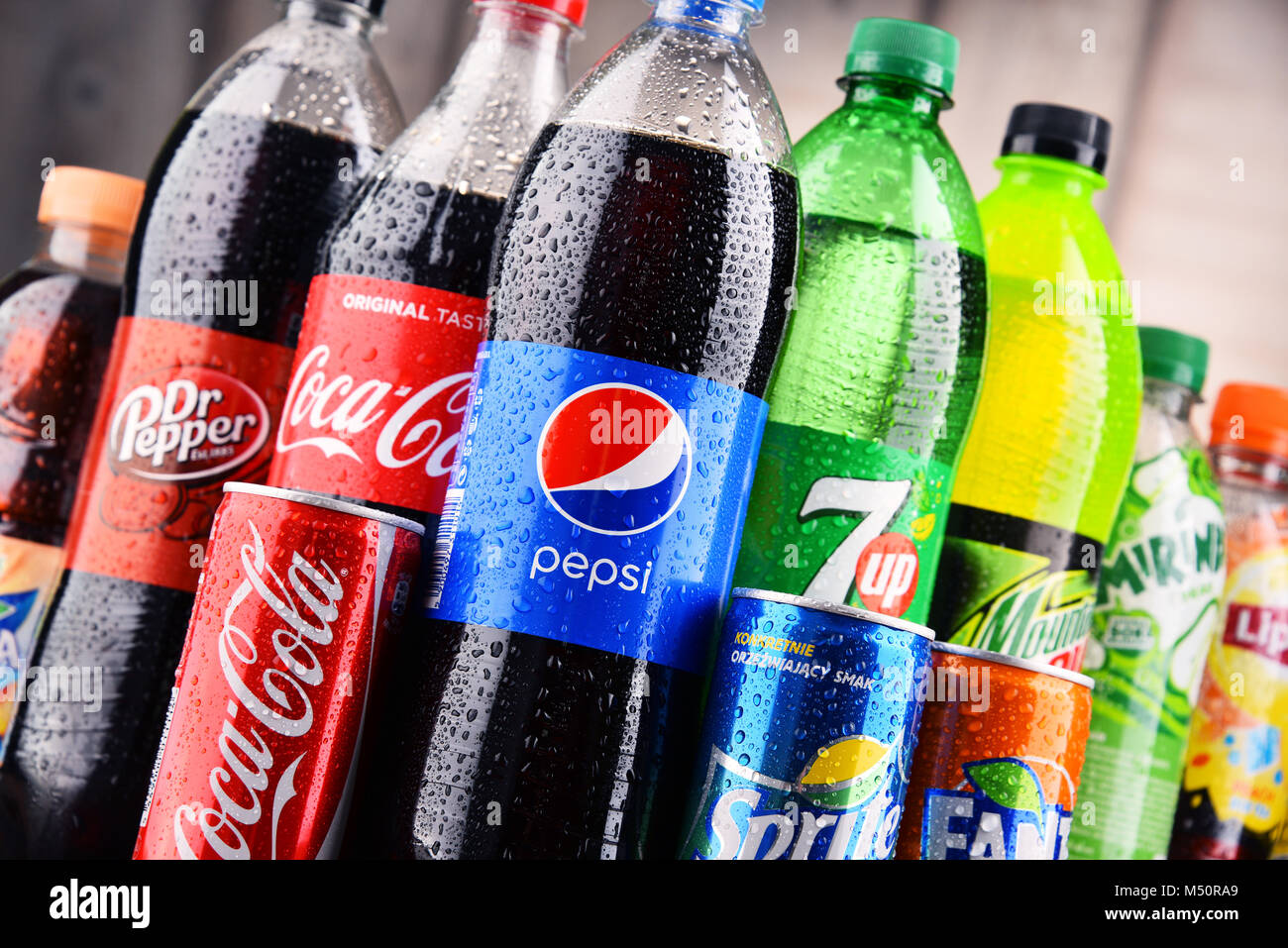 Bottles and cans of assorted global soft drinks Stock Photo Alamy