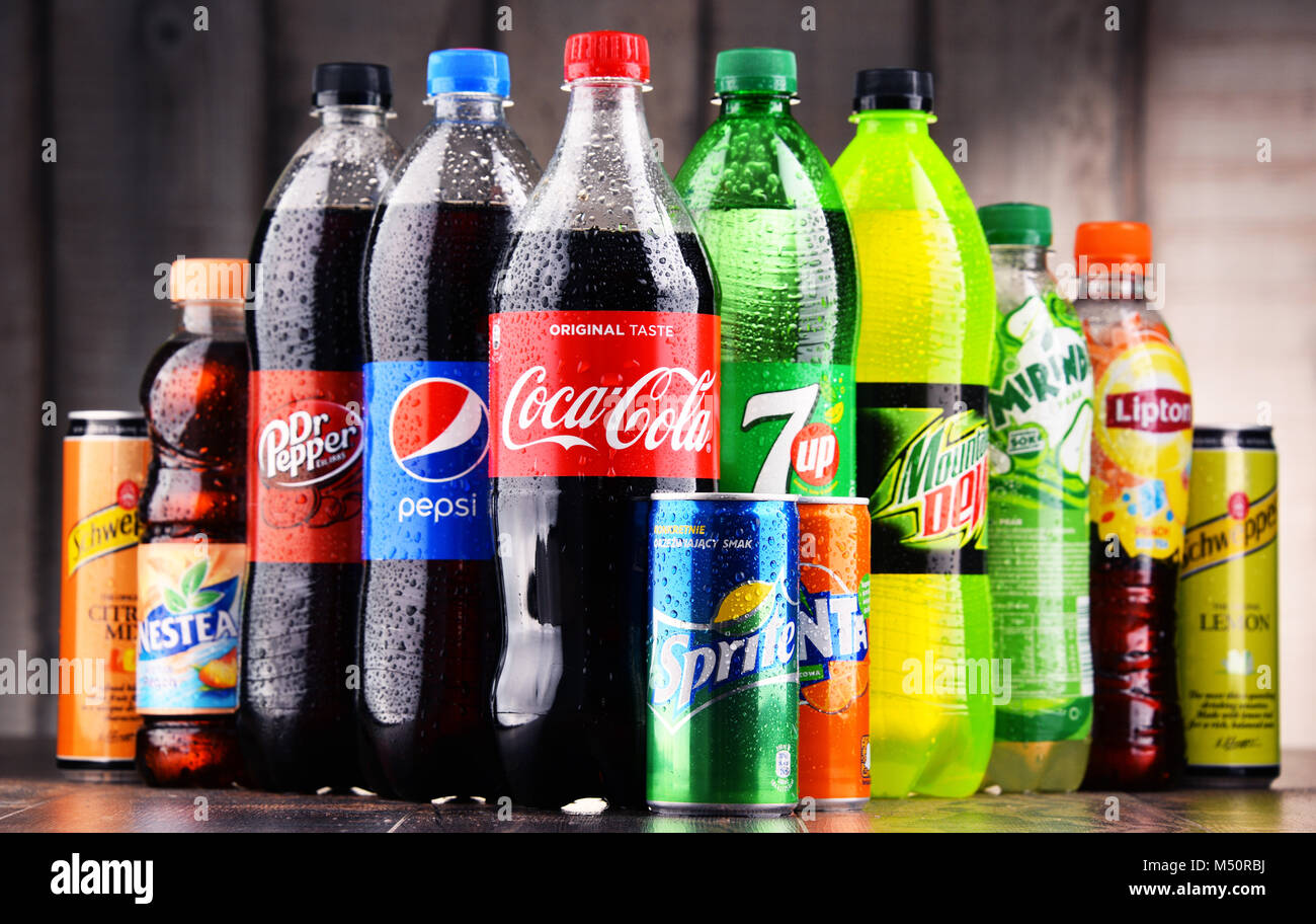 Bottles and cans of assorted global soft drinks Stock Photo Alamy