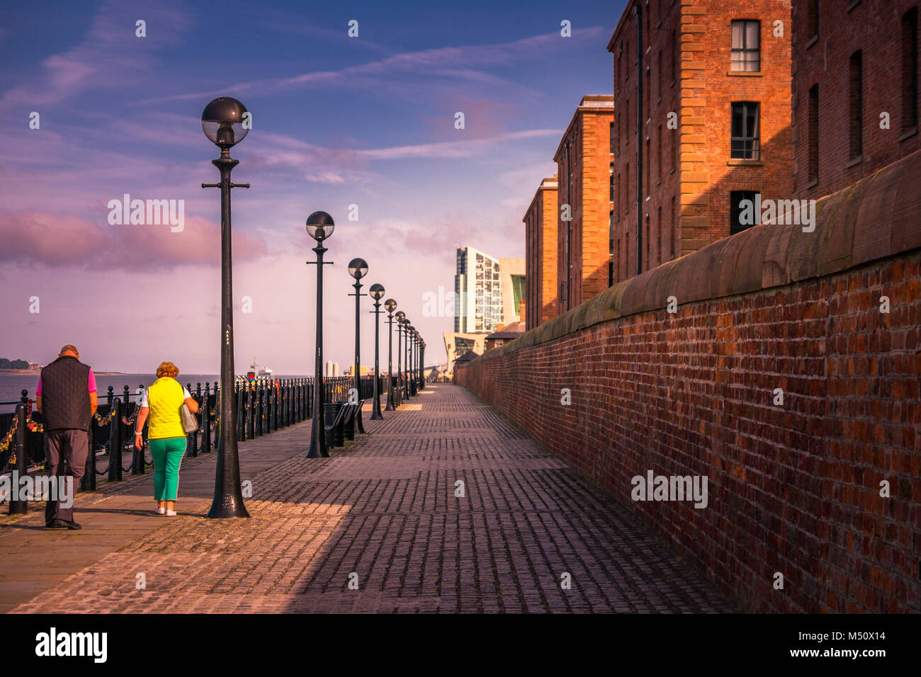 Footpath alongside the Mersey looking towards Liverpool Docklands and the World Heritage Site. Stock Photo