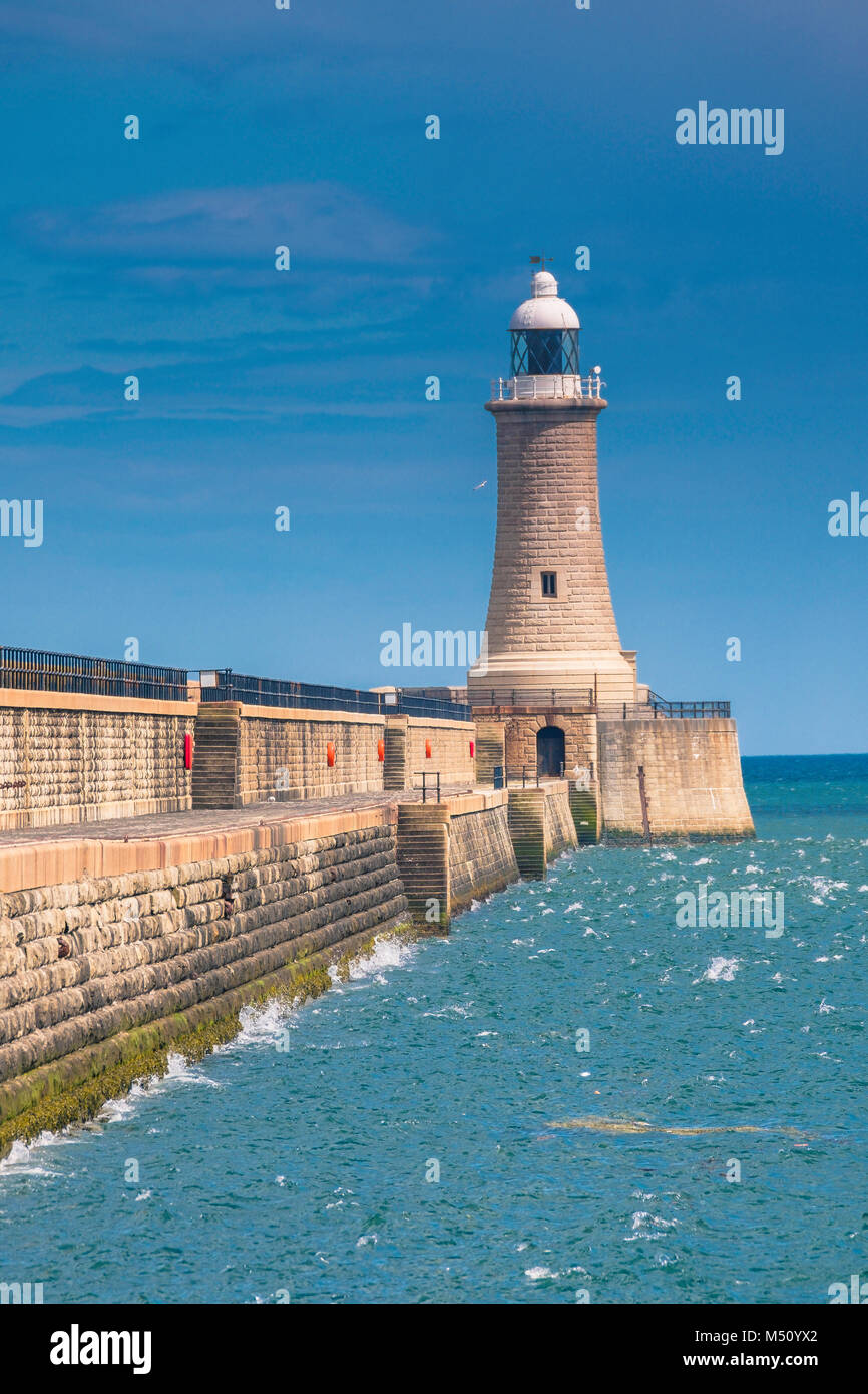 Tynemouth north pier of the harbour and it's lighthouse. Stock Photo