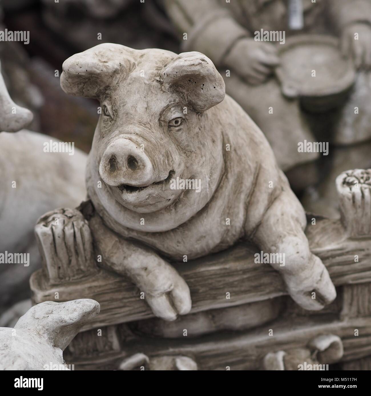 Pig Looking Over Gate - Concrete Ornament Stock Photo