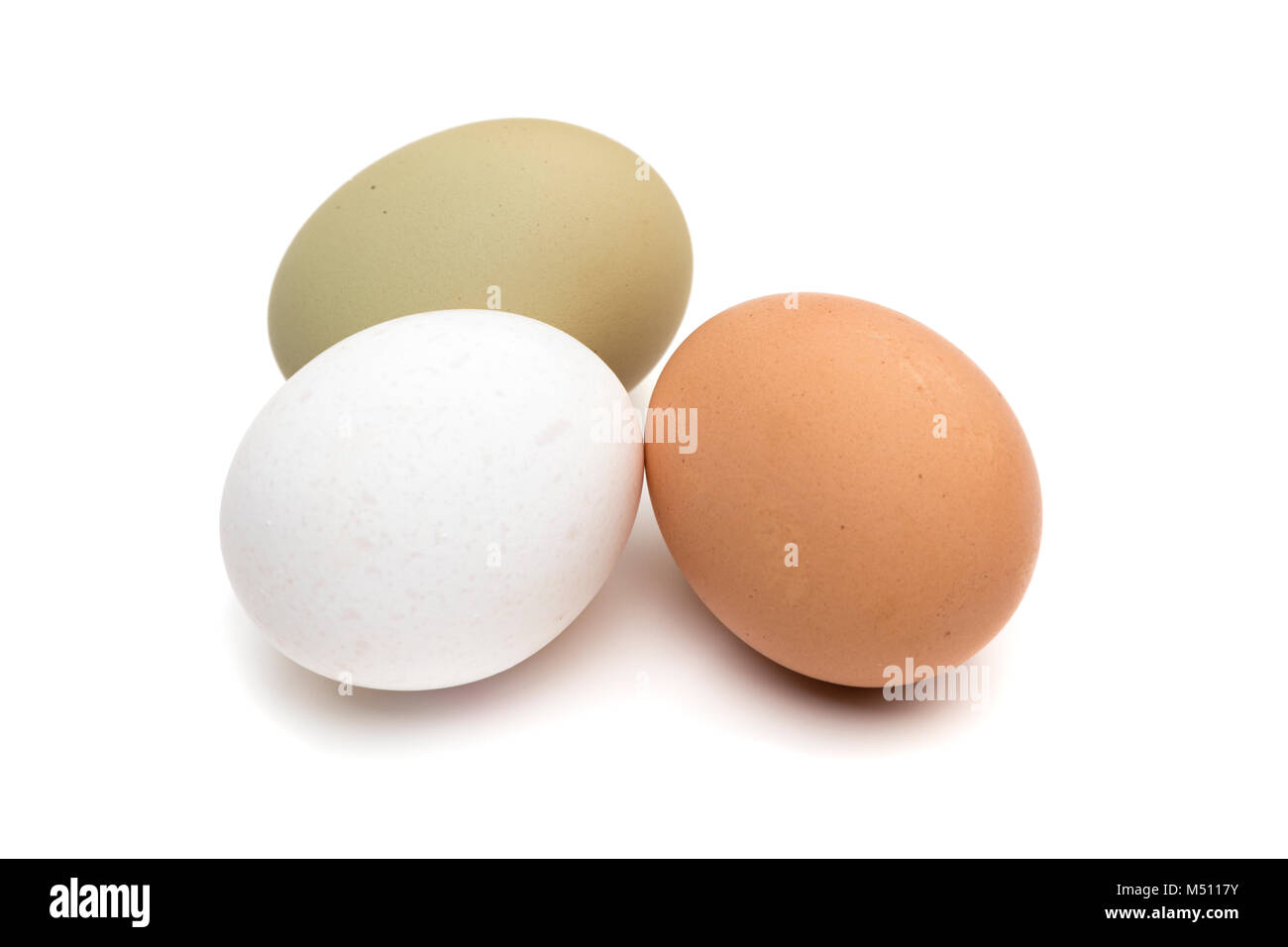 White, brown and green eggs isolated on white background Stock Photo