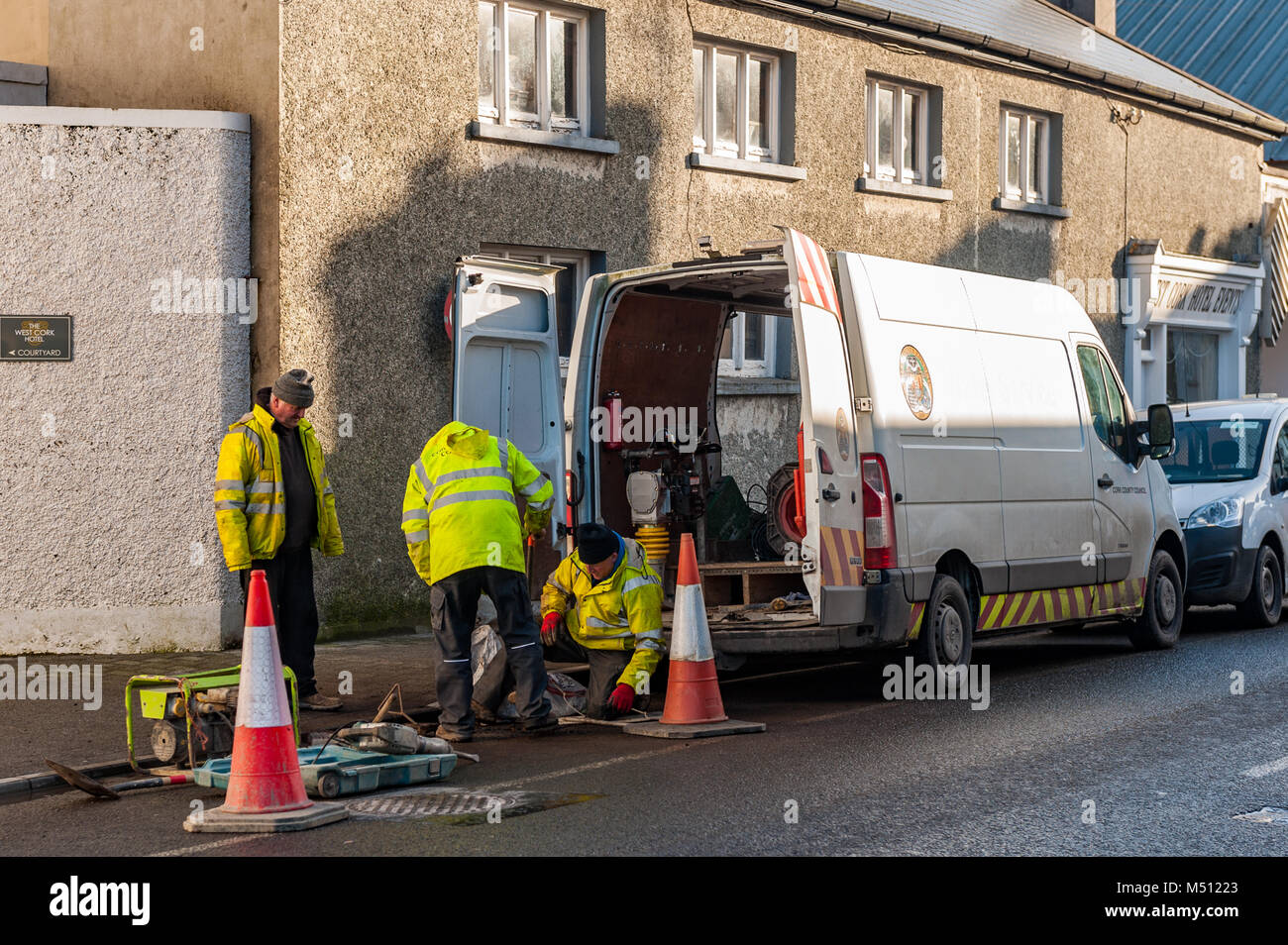 Cork County Council workmen repair the road in Skibbereen, County Cork, Ireland. Stock Photo