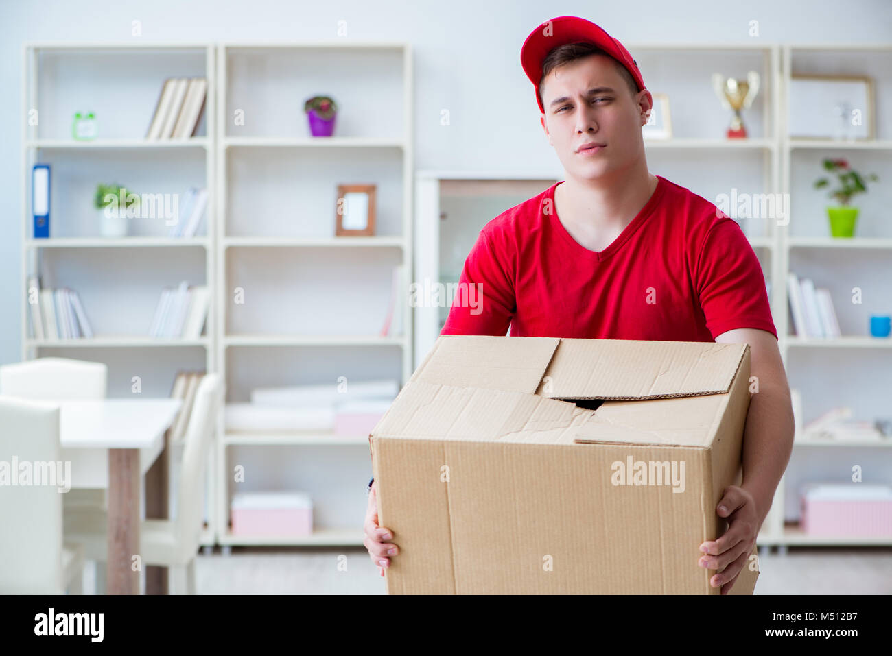 Post man delivering a parcel package Stock Photo Alamy