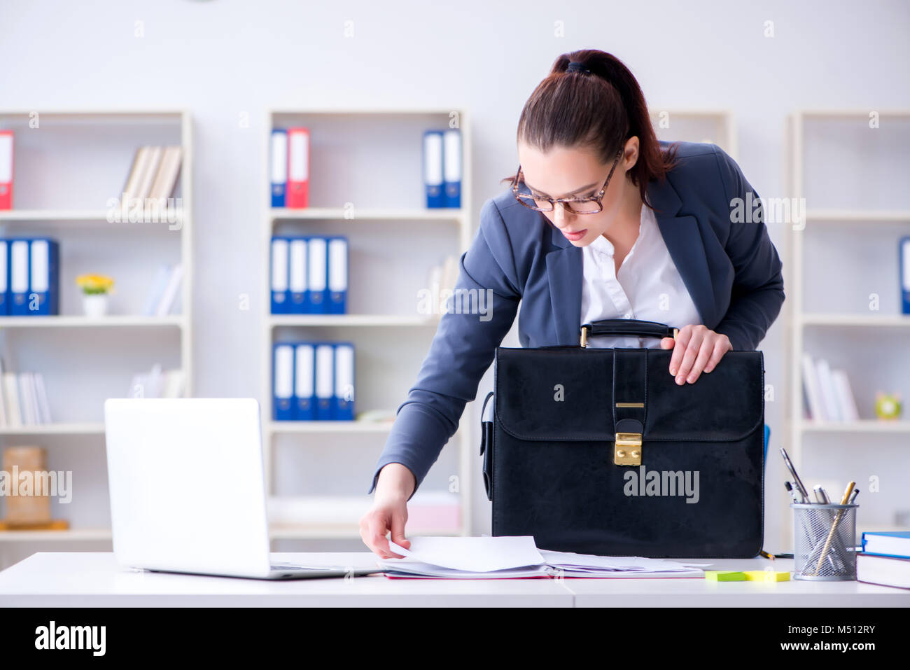 Businesswoman working in the office at desk Stock Photo - Alamy