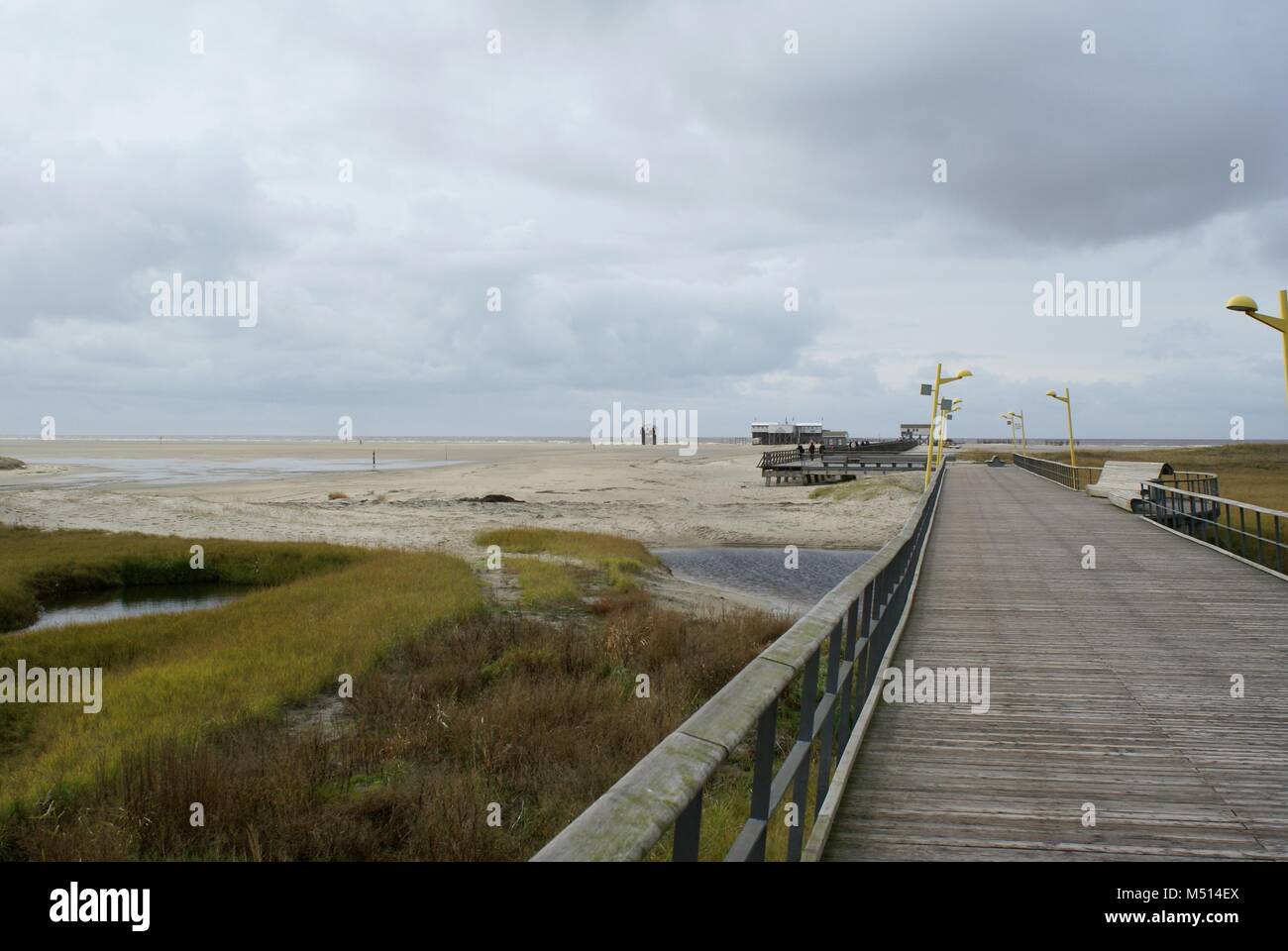 wooden bridge to the see in nordfriesland germany by the sea Stock Photo