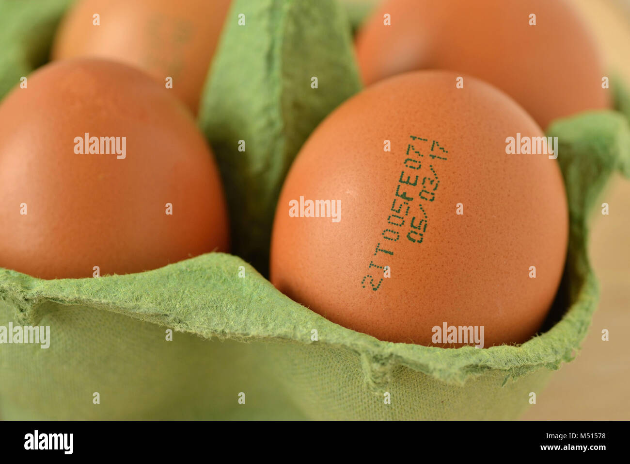 Batch of eggs with expiration date stamp, on egg carton Stock Photo - Alamy