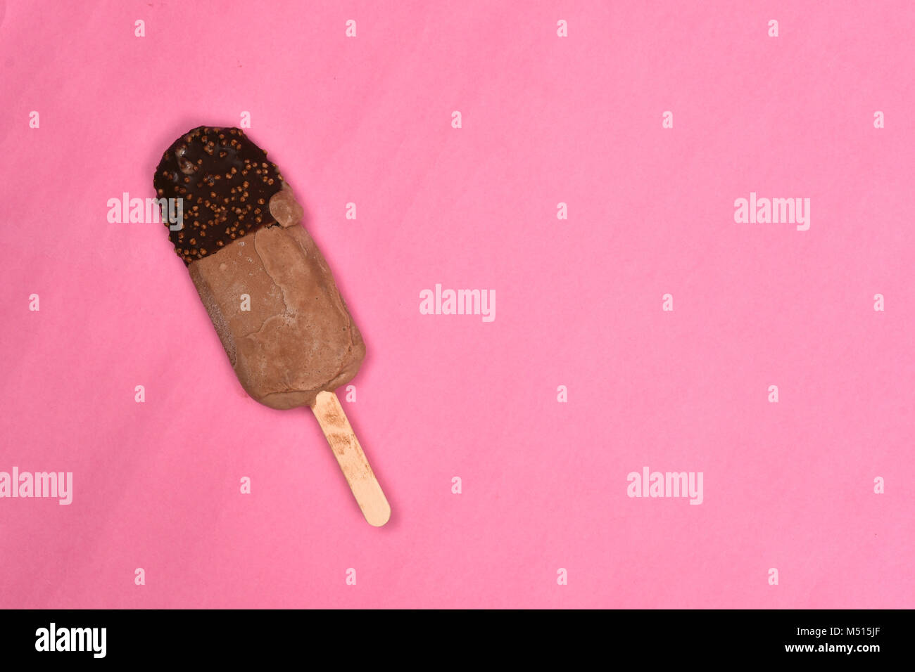 chocolate flavored ice cream isolated on pink background. sweet food concept Stock Photo