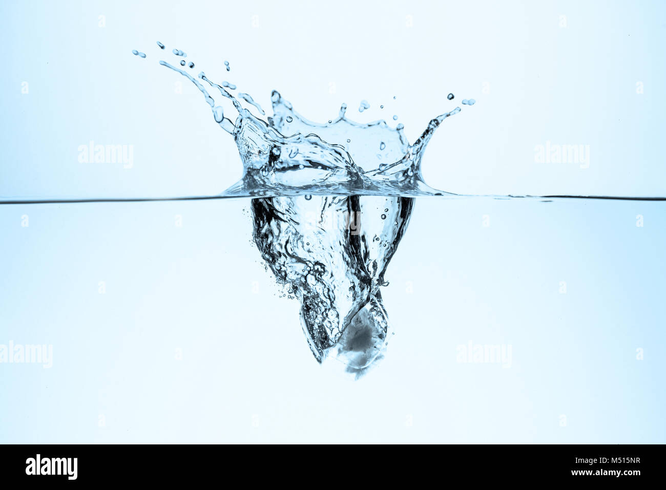 ice cube in water with splash and drops, isolated on white Stock Photo ...