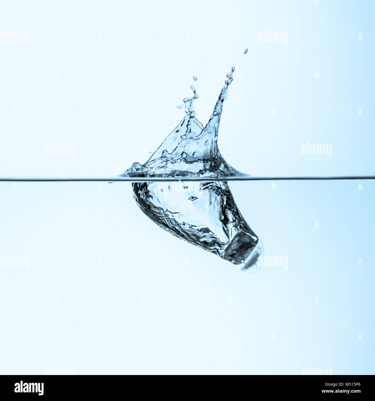 ice cube in clear water, isolated on white Stock Photo - Alamy