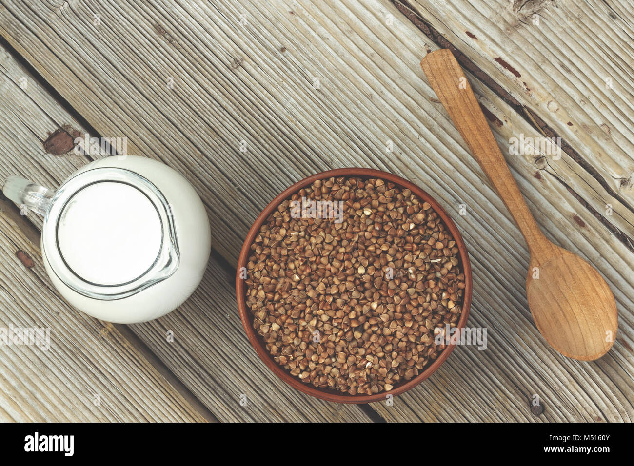 Baby food or sports nutrition. Buckwheat and milk Stock Photo Alamy