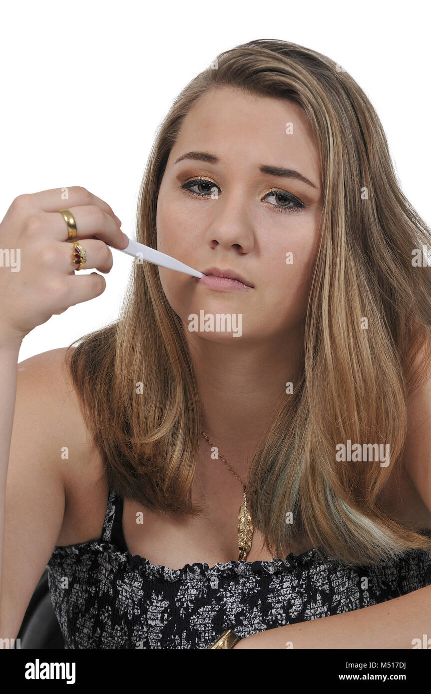 Woman with oral thermometer Stock Photo