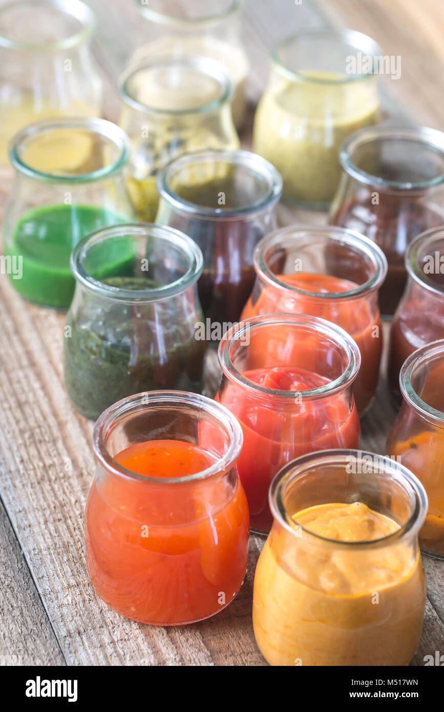 Assortment of sauces in the glass jars Stock Photo Alamy