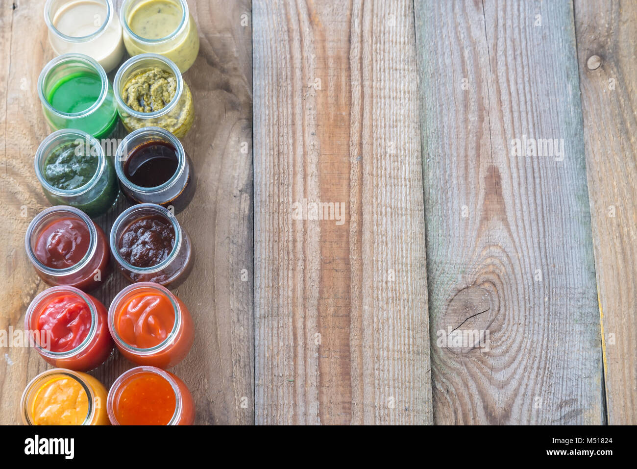 Assortment of sauces in the glass jars Stock Photo Alamy