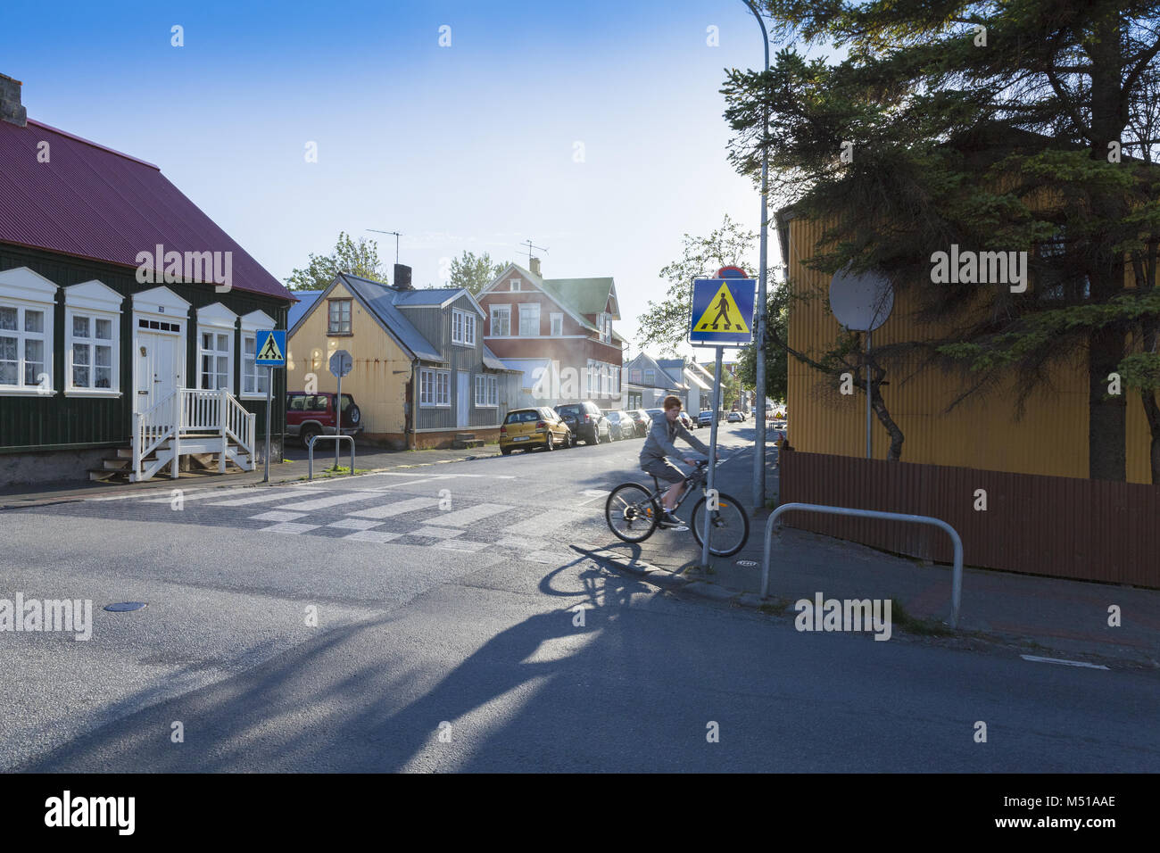 Reykjavik tipical houses with boy on bike Stock Photo