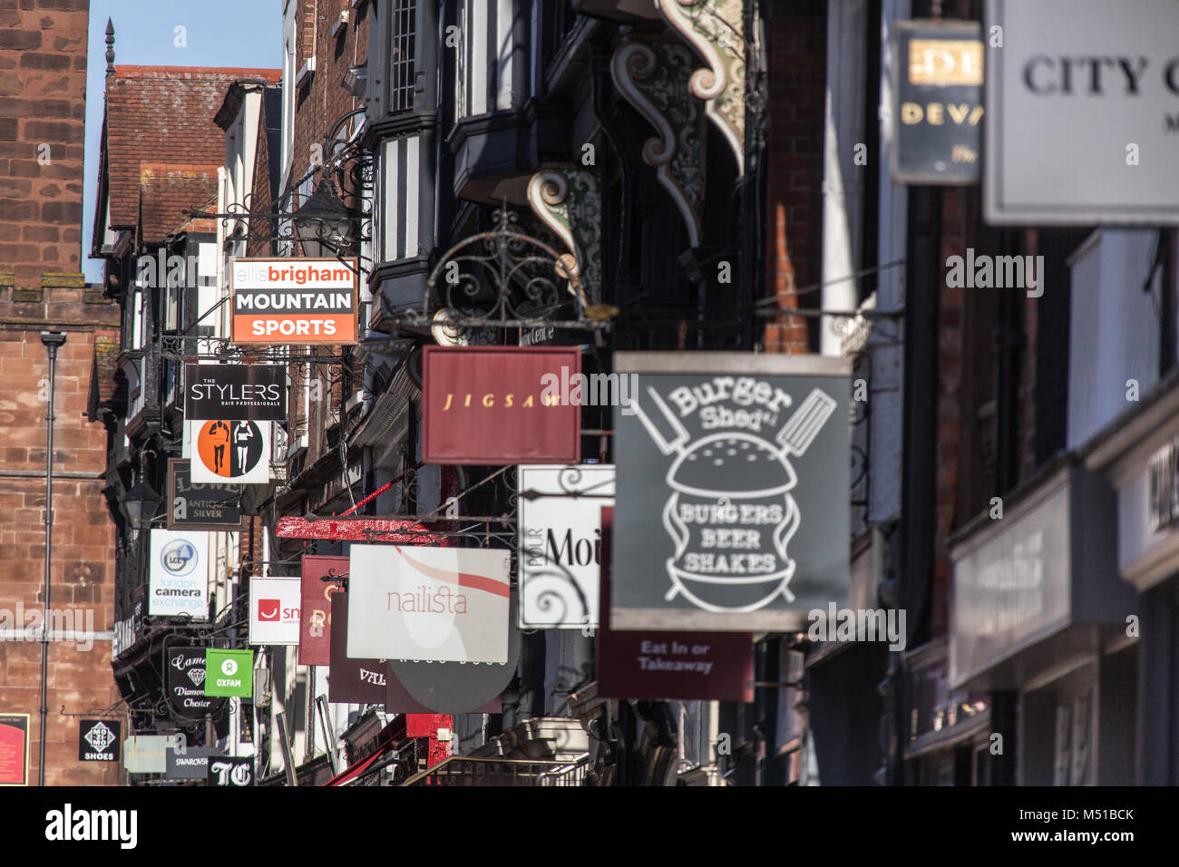 City of Chester, England. Picturesque view of shop signs on Chester’s Bridge Street rows. Stock Photo