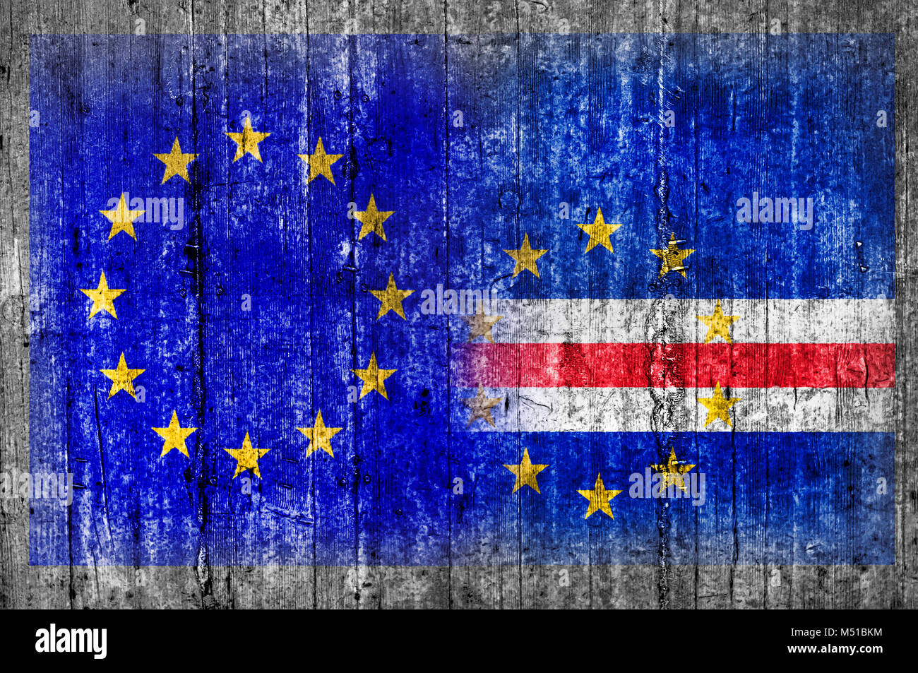 EU and Cape Verde flag on concrete wall Stock Photo