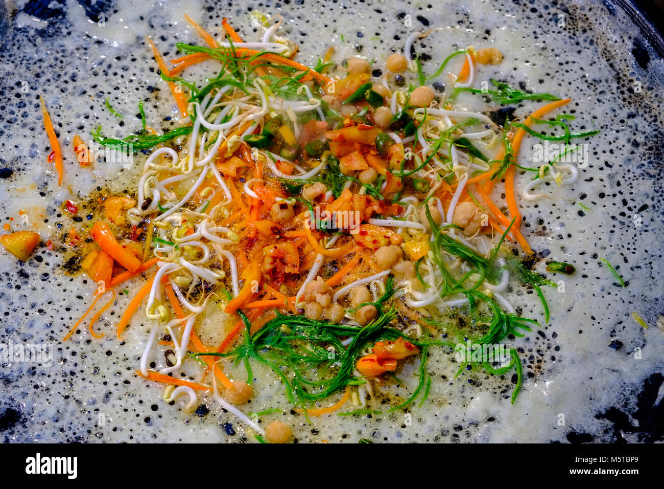 Myanmar pizza, a popular snack, is displayed for sale at a street restaurant Stock Photo