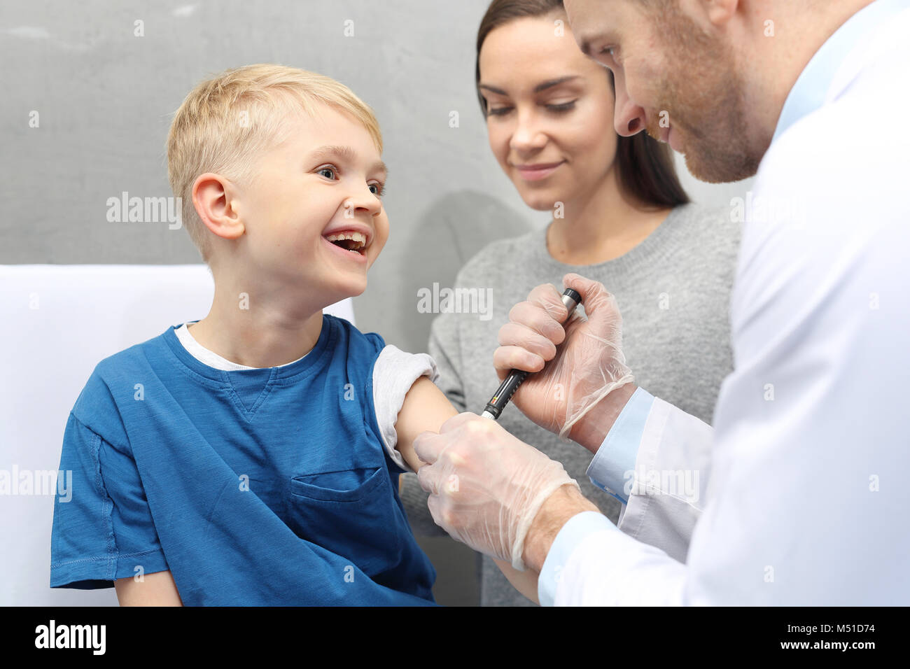 Injection with insulin. A child with diabetes when injecting insulin Stock Photo