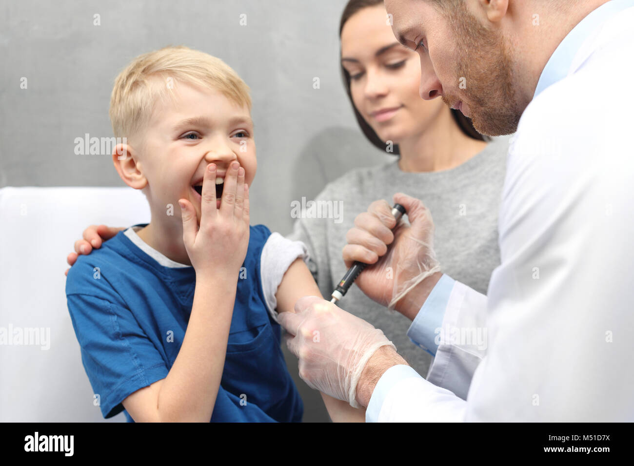Diabetes clinic for children. A child with diabetes when injecting insulin Stock Photo