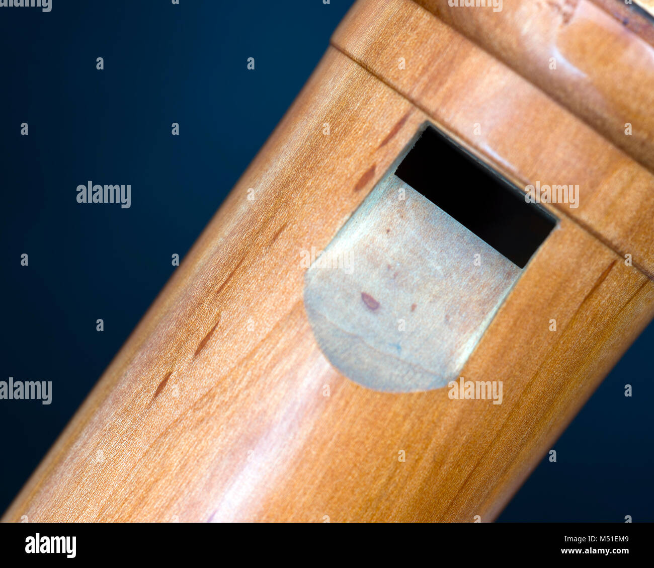 part of bass recorder against dark background Stock Photo - Alamy