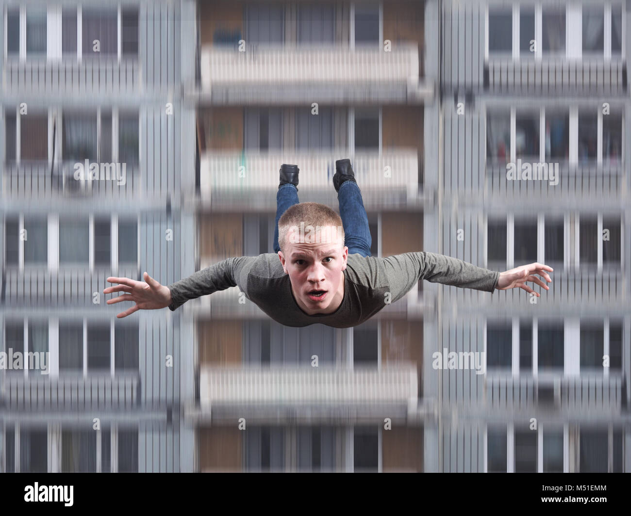 A young man falls from a high house. Suicide Stock Photo