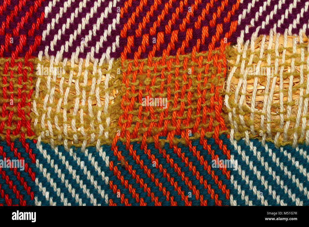 Textured woollen woven piece of material in bright colourful colours Stock Photo