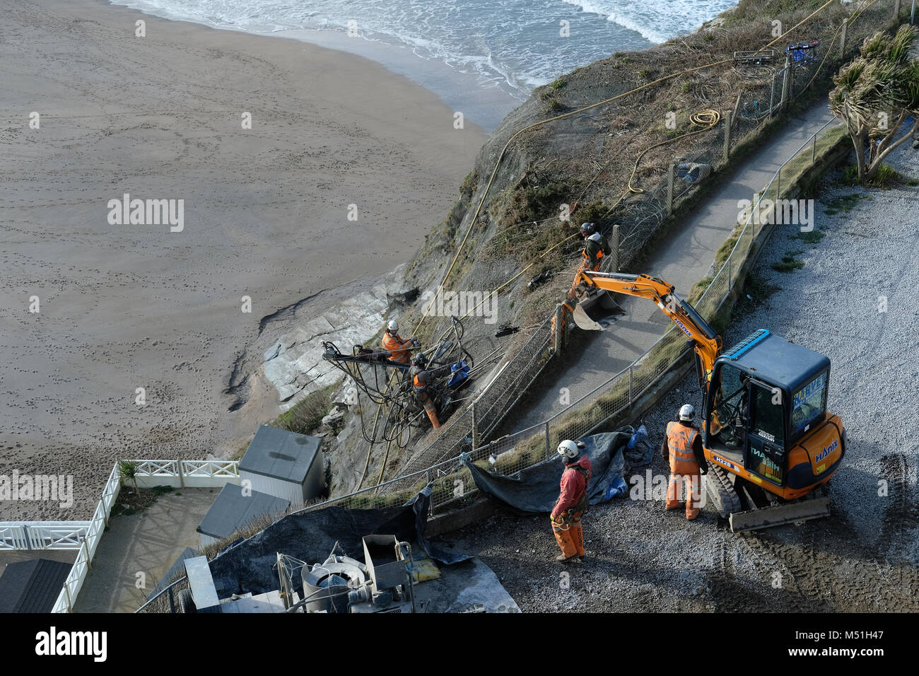 Men working on cliff repairs in Newquay, Cornwall. Stock Photo