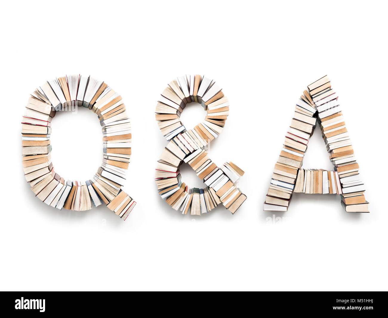 Q & A letters formed from books, shot from above on white background ...