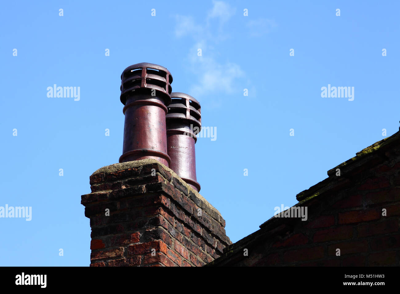 Chimney against blue sky Stock Photo