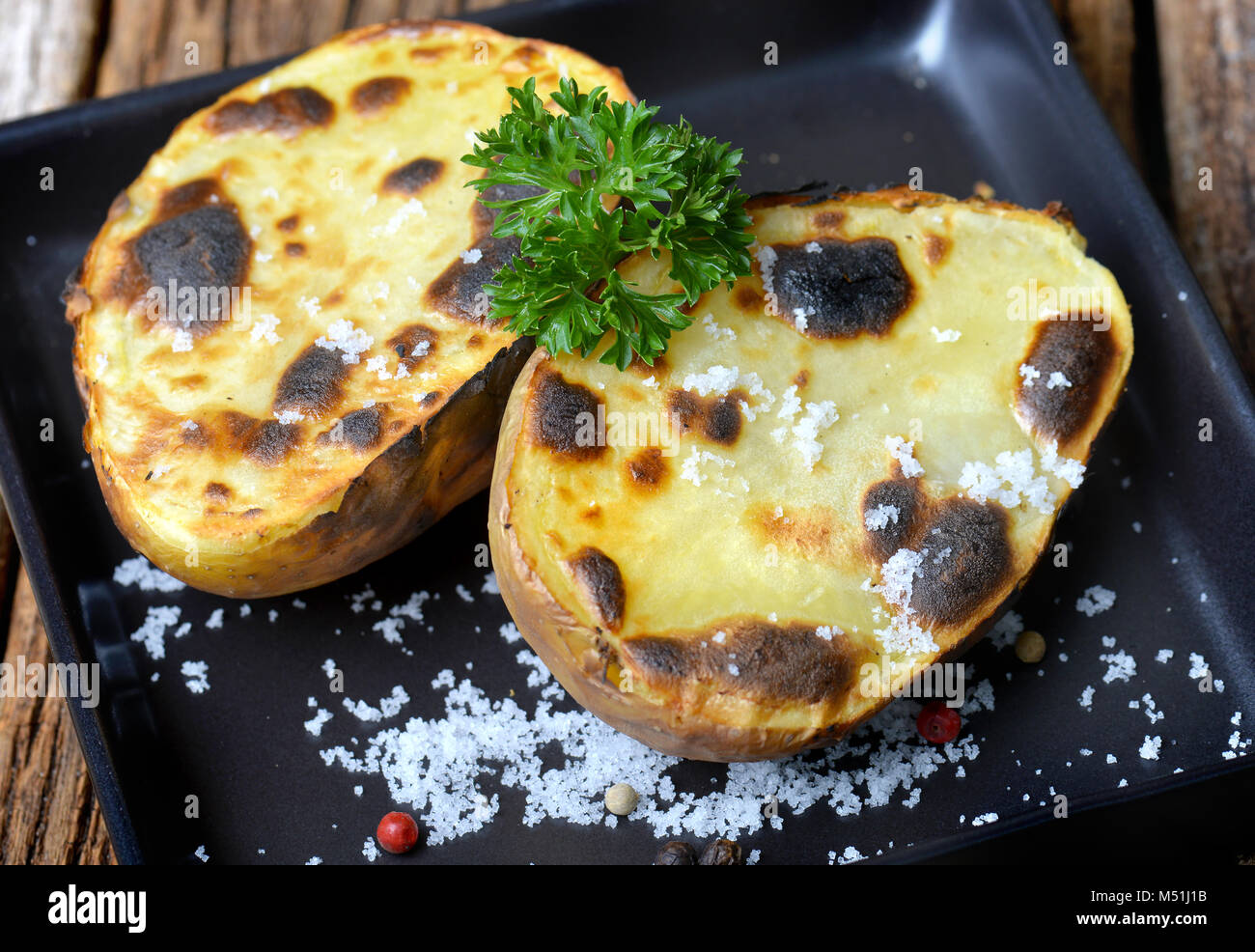 Potato baked and grill with charcoal fire and salt for appertizer in