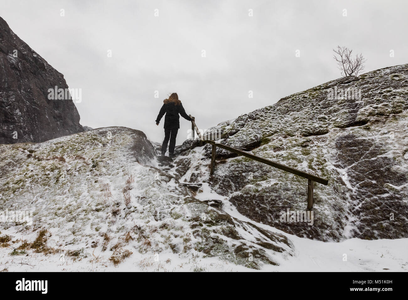 Silhouette woman hiker climbing alone hi-res stock photography and ...