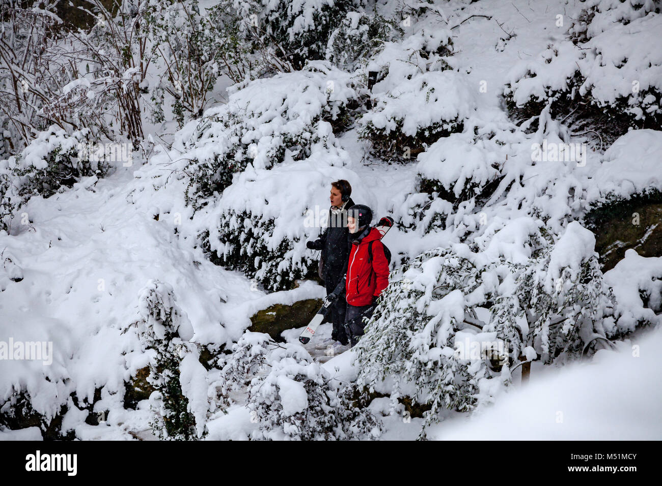 People skiing and enjoying the snow in Louise Michel square in Paris, Montmartre, France Stock