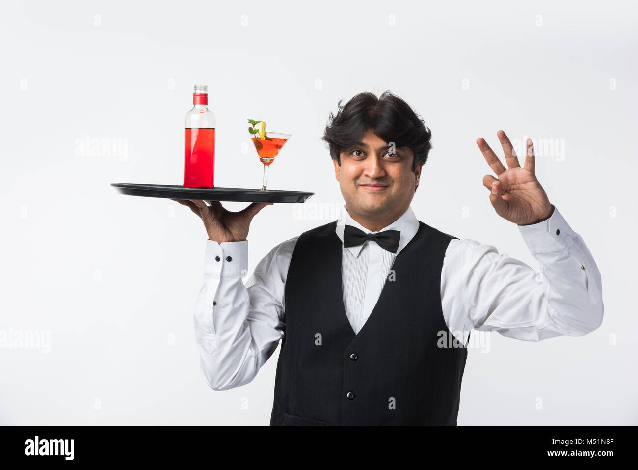 Asian Indian waiter or Bartender isolated over white background, selective focus Stock Photo