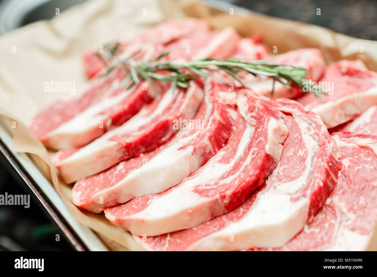 Selection of different cuts of fresh raw red meat in a supermarket