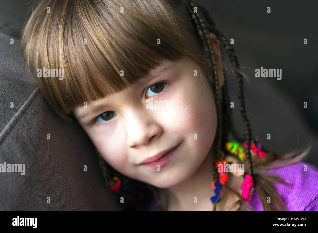 Portrait of pretty little girl with small braids Stock Photo - Alamy