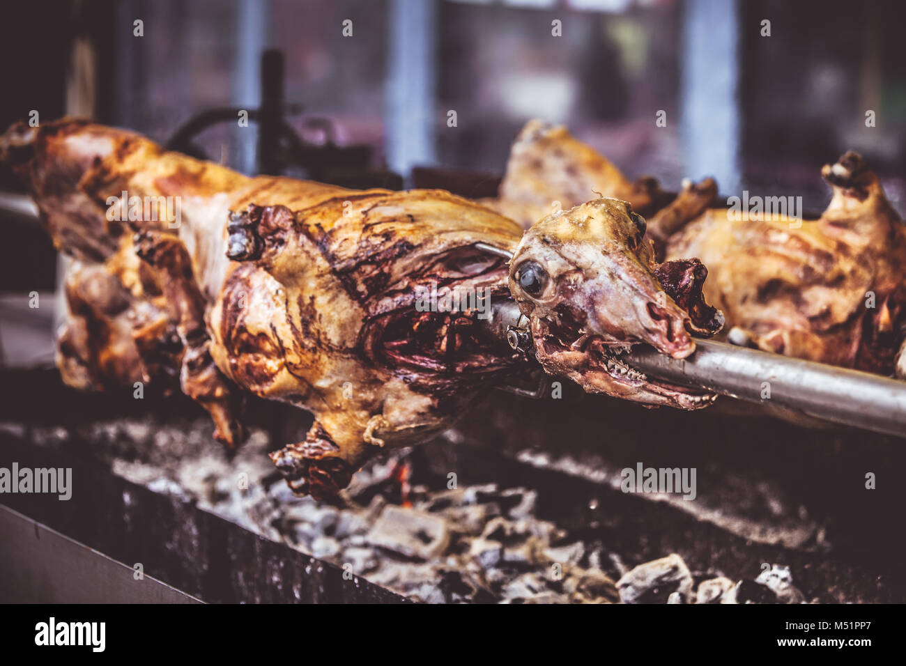 Roast lamb on a spit. Selective focus and small depth of field Stock