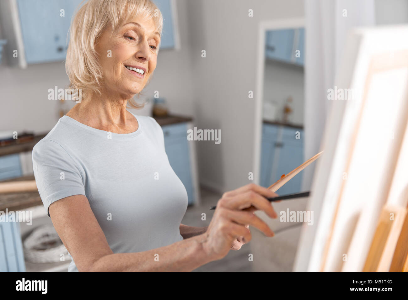 Gay mature woman drawing painting Stock Photo