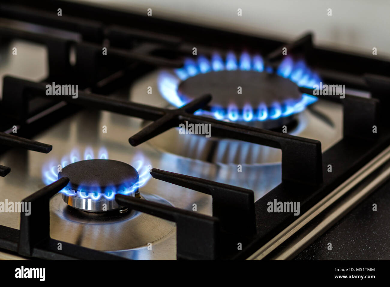 Natural Gas Burning On Kitchen Gas Stove In The Dark Panel From