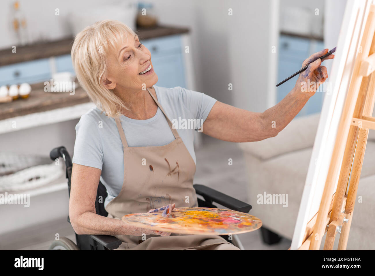 Mature disabled woman developing her talent Stock Photo