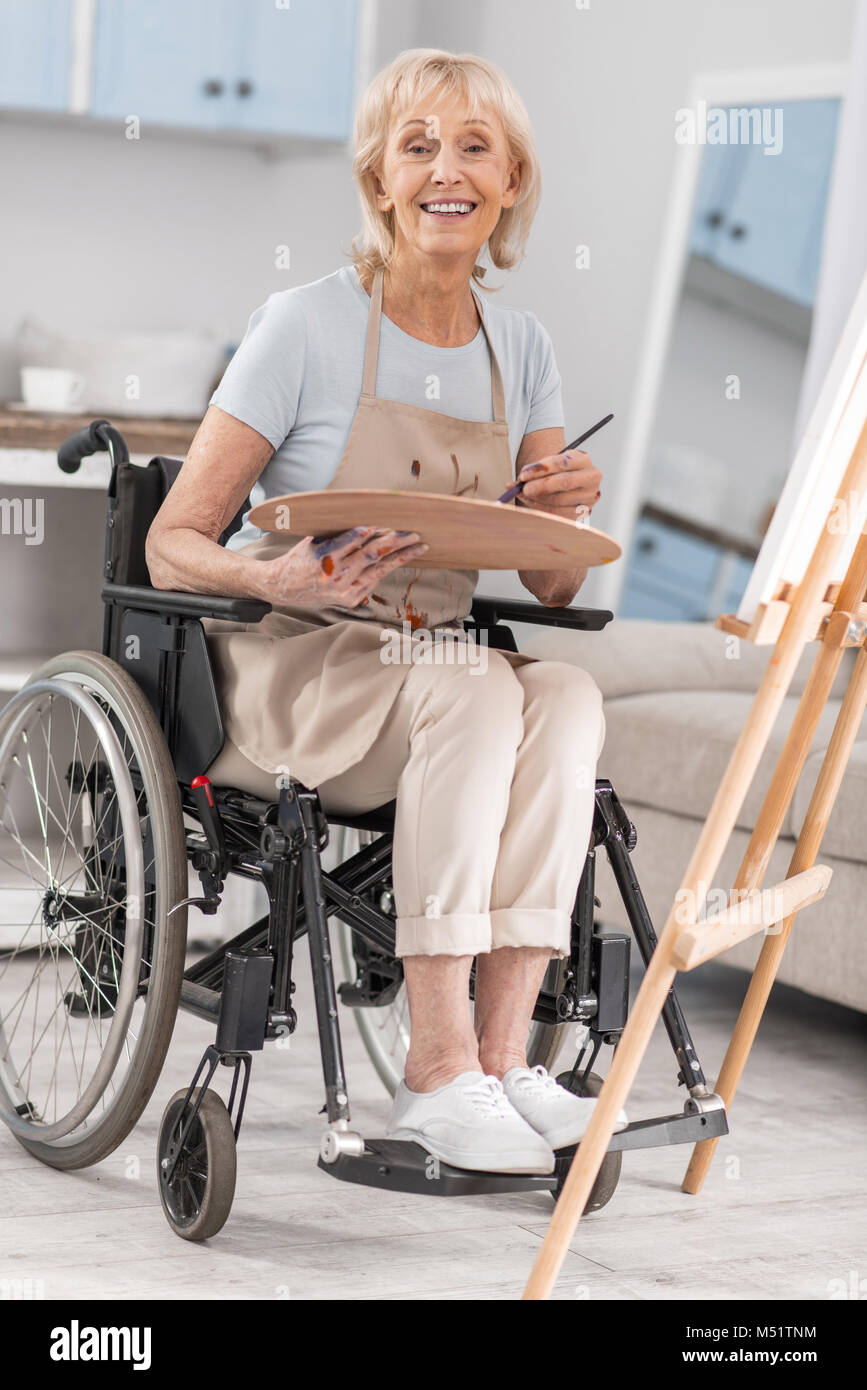 Handicapped mature woman freeing her talent Stock Photo