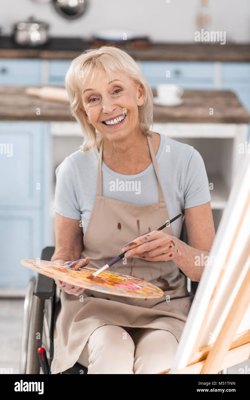 Disabled mature woman moving forward Stock Photo