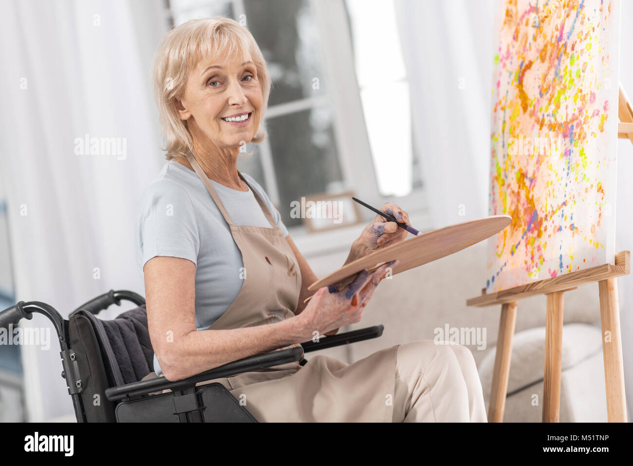 Mature handicapped woman improving herself Stock Photo