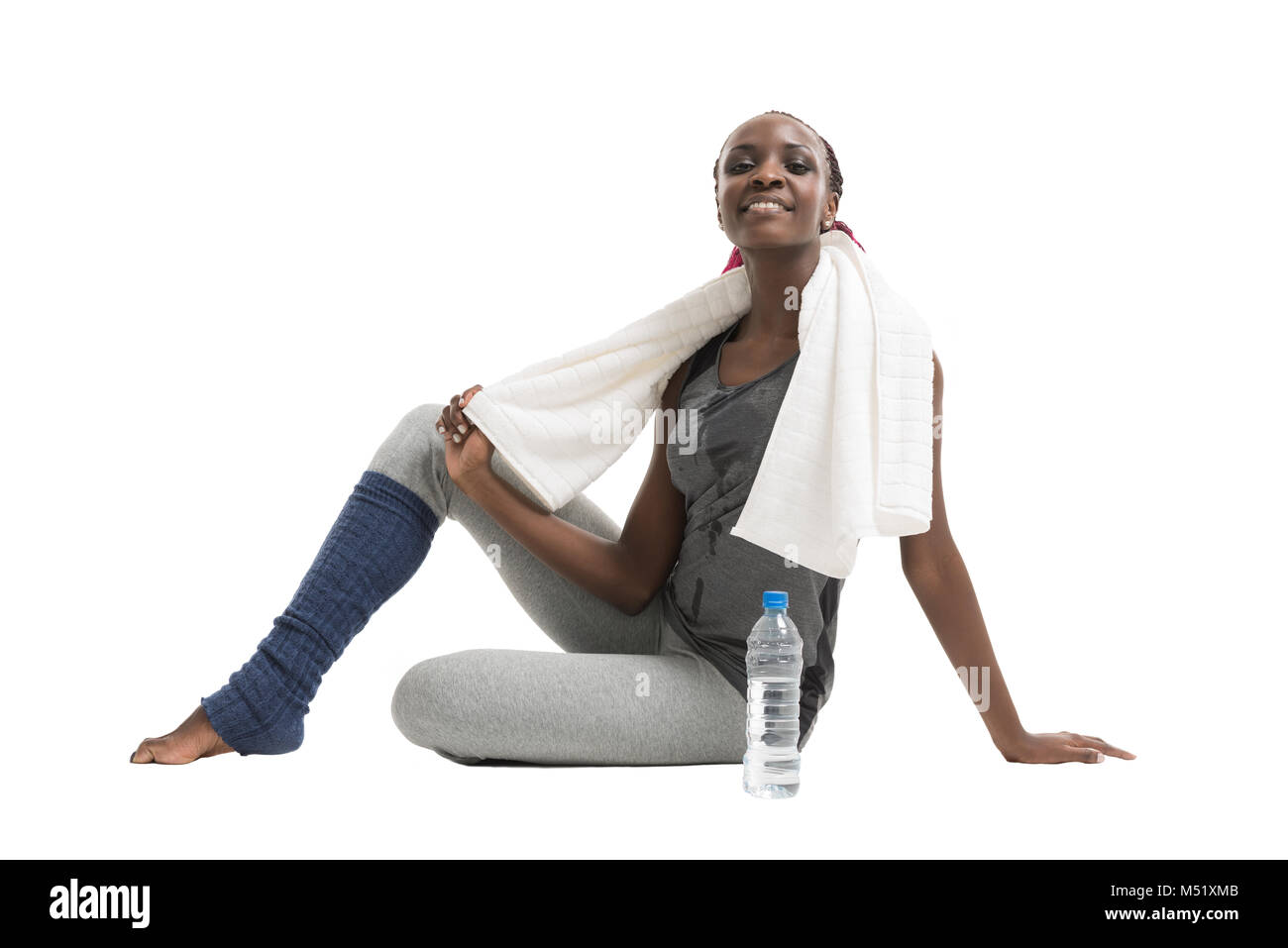 Athletic girl with a bottle of water and towel Stock Photo - Alamy